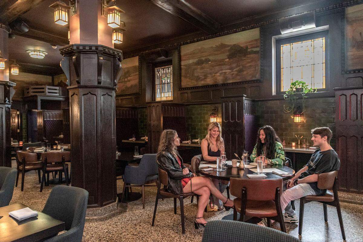 Happy hour visitors at The Savoy, still operating at the spot where it opened in 1903.