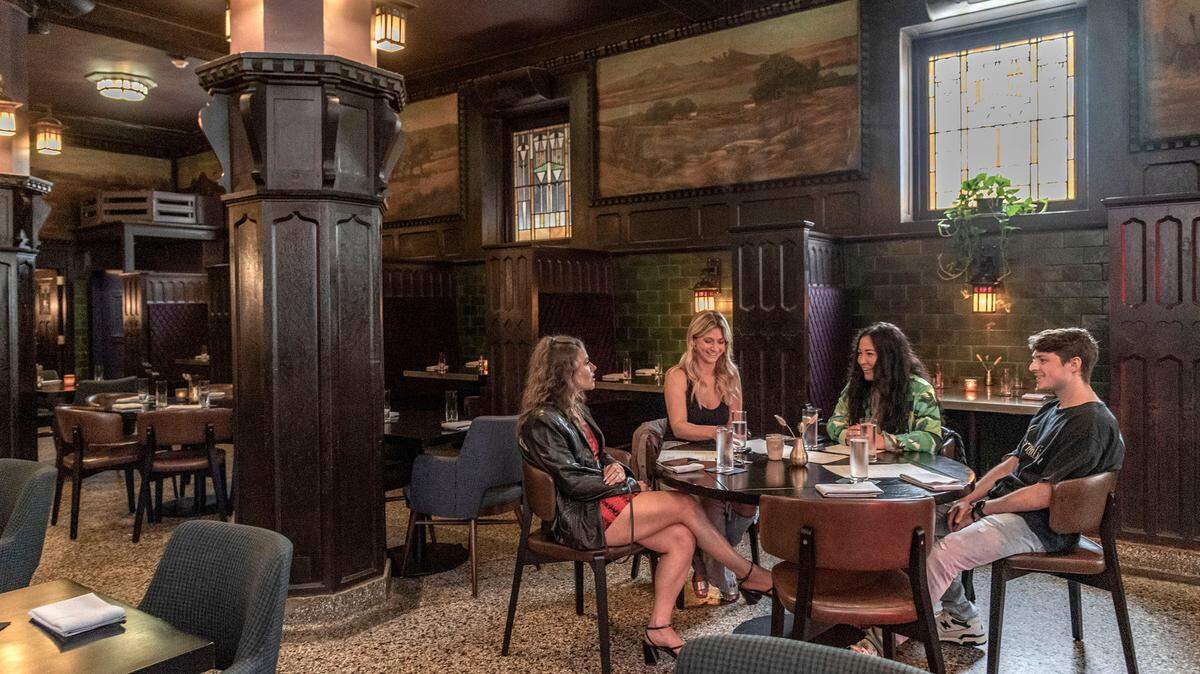 Happy hour visitors at The Savoy, still operating at the spot where it opened in 1903.