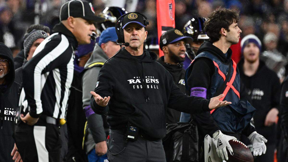 Baltimore Ravens head coach John Harbaugh (center) questions a call against the Kansas City Chiefs during the second half in the AFC Championship football game at M&T Bank Stadium.