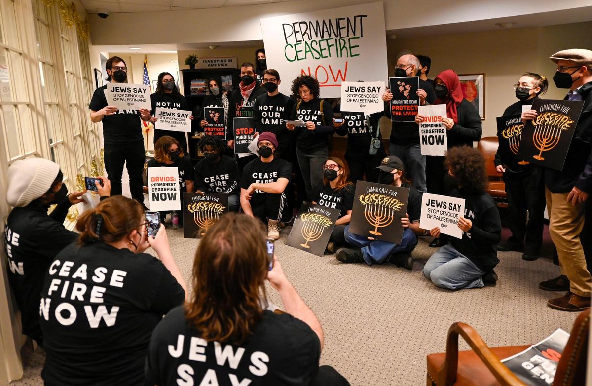 Ahead of the first night of Hanukkah, Jewish and some non-Jewish constituents of Rep. Sharice Davids are calling for a ceasefire for the war in Gaza during peaceful occupation of Davids’ office on Dec. 7, 2023, in Overland Park. The group, Jewish Voice for Peace-Kansas City, wants Davids to call for an immediate, permanent ceasefire in the Gaza Strip by co-sponsoring HR 786.