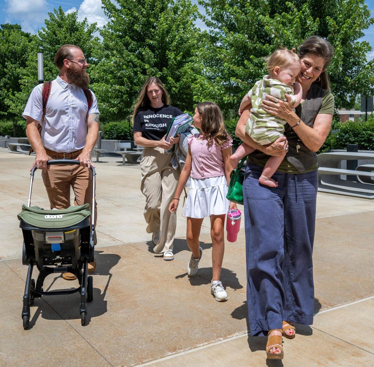Brian Boxx, left, walks with his wife Sarah Goble, their children Finnik and Sawyer, and Sarah’s mother, Kim Goble.