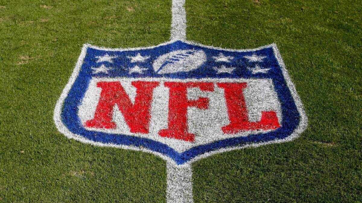 FILE - In this Nov. 4, 2018 file photo, the NFL logo is displayed on the field at the Bank of American Stadium before an NFL football game between the Tampa Bay Buccaneers and the Carolina Panthers in Charlotte, N.C. The NFL revealed Sunday, Aug. 23, 2020, that several positive COVID-19 tests were found a day earlier by one of its testing partners, and the Chicago Bears said they had nine false positives. (AP Photo/Nell Redmond, File)