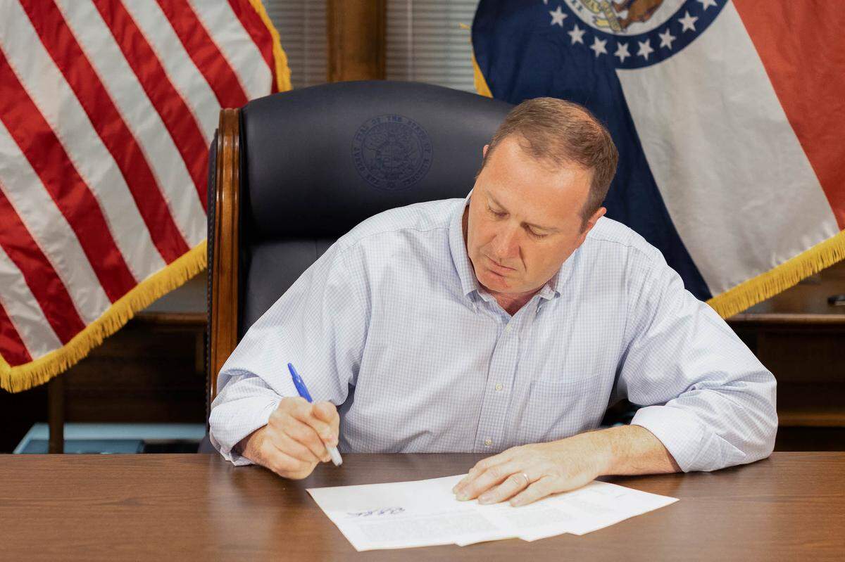 Missouri Attorney General Eric Schmitt signs a legal opinion to trigger an abortion ban in Missouri in 2022 following the overturning of Roe v. Wade.