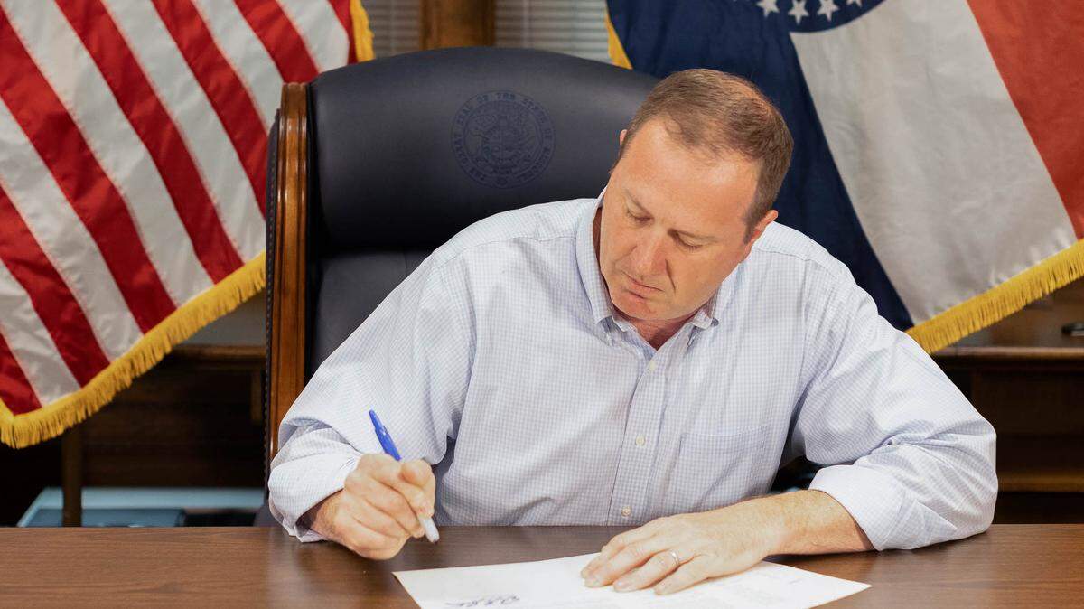 Missouri Attorney General Eric Schmitt signs a legal opinion to trigger an abortion ban in Missouri.