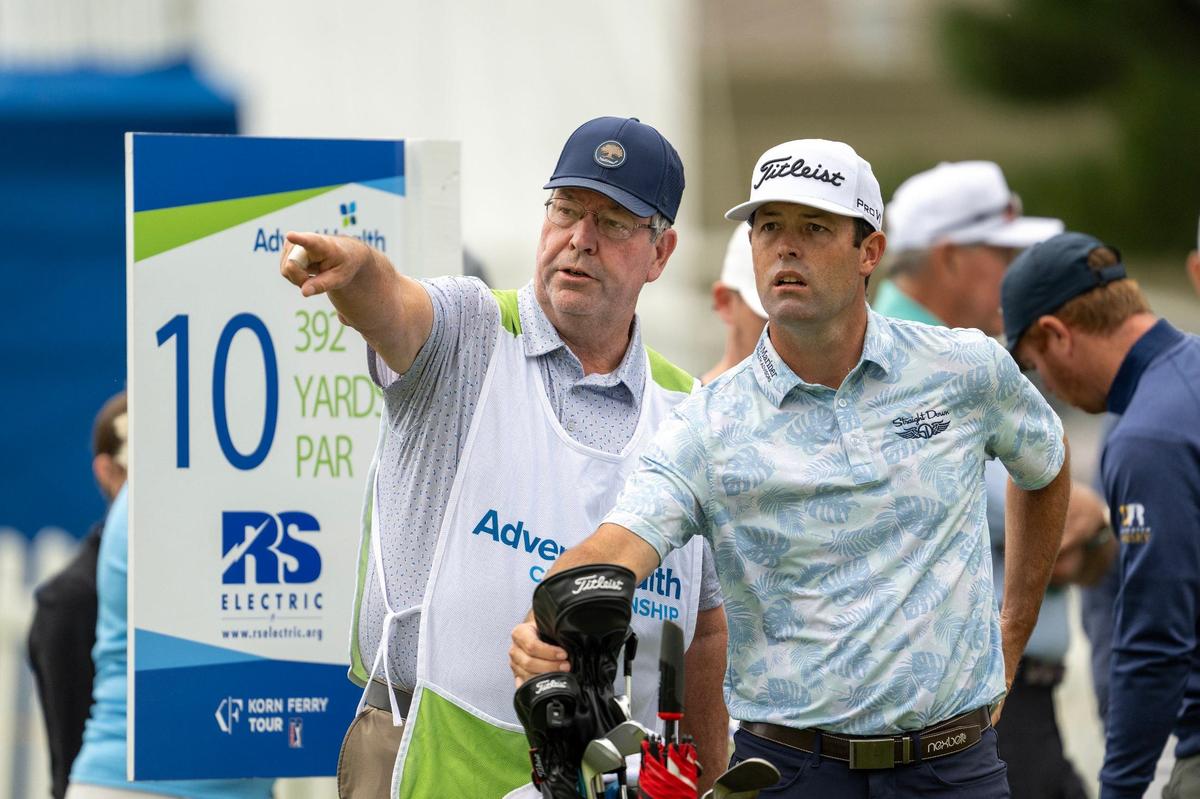 Robert Streb of Shawnee, talks with his caddie before teeing off in the first round of the AdventHealth Championship on Thursday, May 16, 2024, at Blue Hills Country Club in Kansas City.