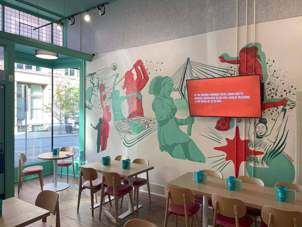 A mural on the wall of The Dub depicts women athletes in Kansas City’s first women-centric sports bar.