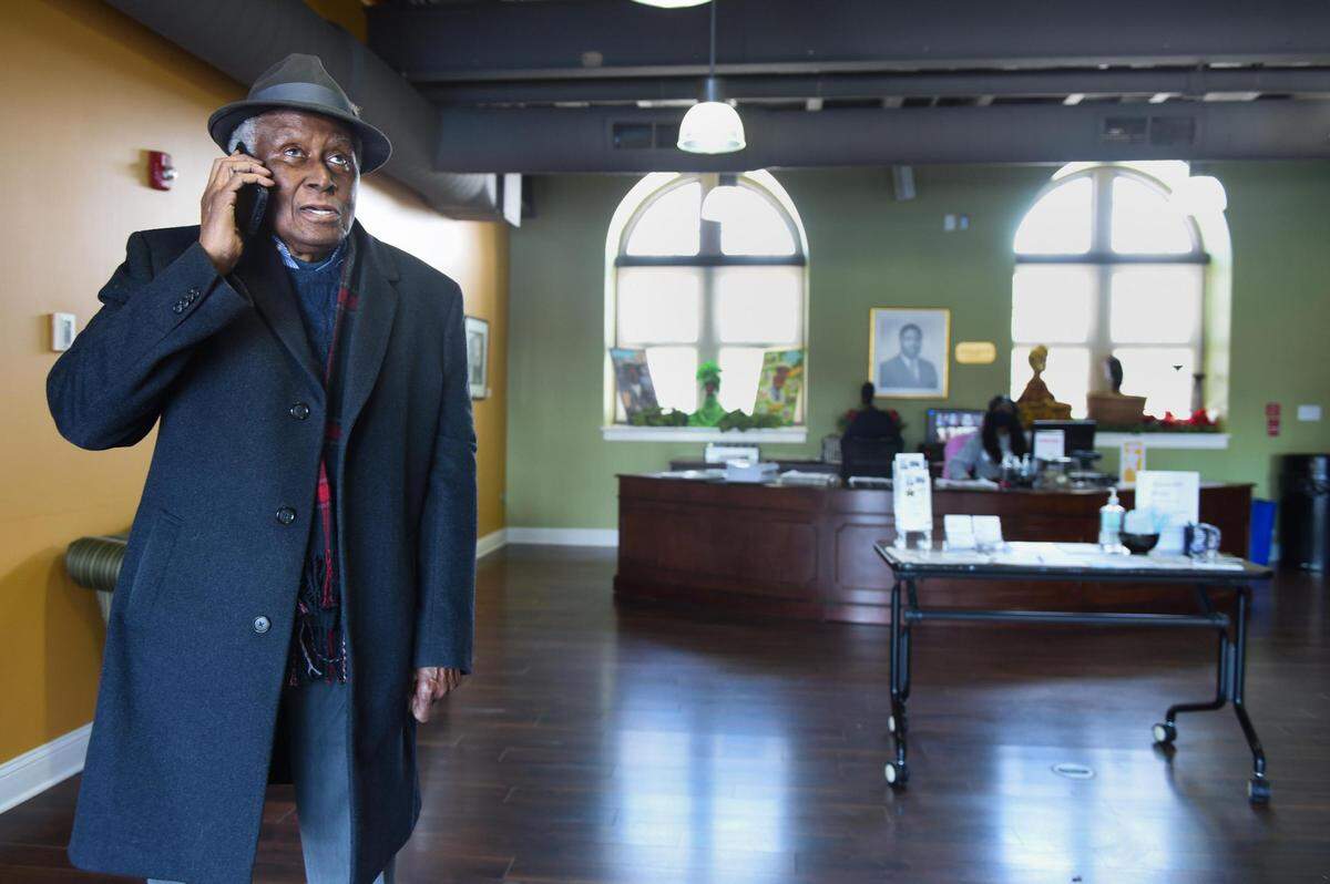 During a stop Thursday at the Black Archives of Mid-America, Alvin Brooks took a call from Carrie Brooks-Brown, one of his five daughters.