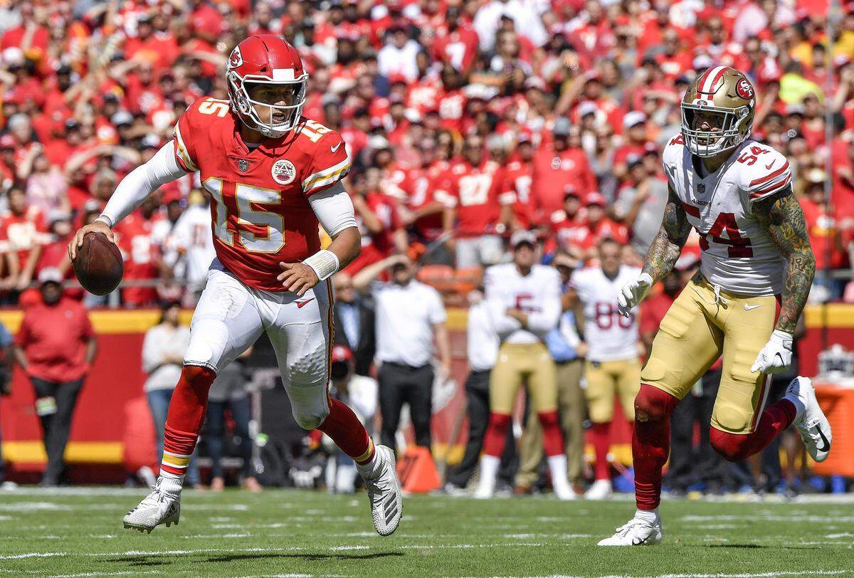 Kansas City Chiefs quarterback Patrick Mahomes scrambled away from San Francisco 49ers defensive end Cassius Marsh before throwing a touchdown to wide receiver Chris Conley in the second quarter in Kansas City. It was Mahomes’ 11th touchdown pass of the 2018 regular season.