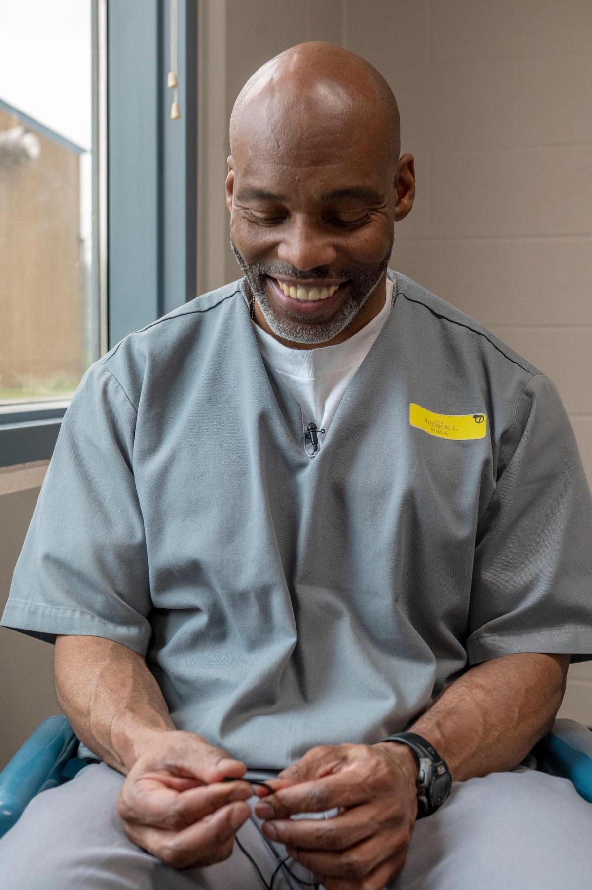 Lamar Johnson laughs during an interview at the Jefferson City Correctional Center. Johnson works six days a week in the prison at a center for Braille and narration, transcribing for the blind and helping create large print books for the visually-impaired.