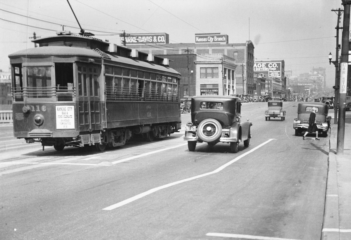 A streetcar shares the street with automobiles in Kansas City in 1929.