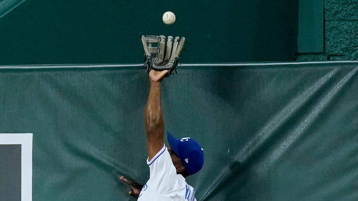 Kansas City Royals center fielder Michael A. Taylor catches a sacrifice fly hit by Milwaukee Brewers’ Jackie Bradley Jr. to score one run during the sixth inning of a baseball game Wednesday, May 19, 2021, in Kansas City, Mo. (AP Photo/Charlie Riedel)