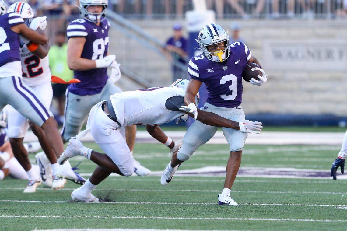 Kansas State Wildcats running back Dylan Edwards (3) is tackled by Tennessee-Martin Skyhawks cornerback Robert Johnson (3) during the first quarter at Bill Snyder Family Football Stadium on Aug. 31, 2024.