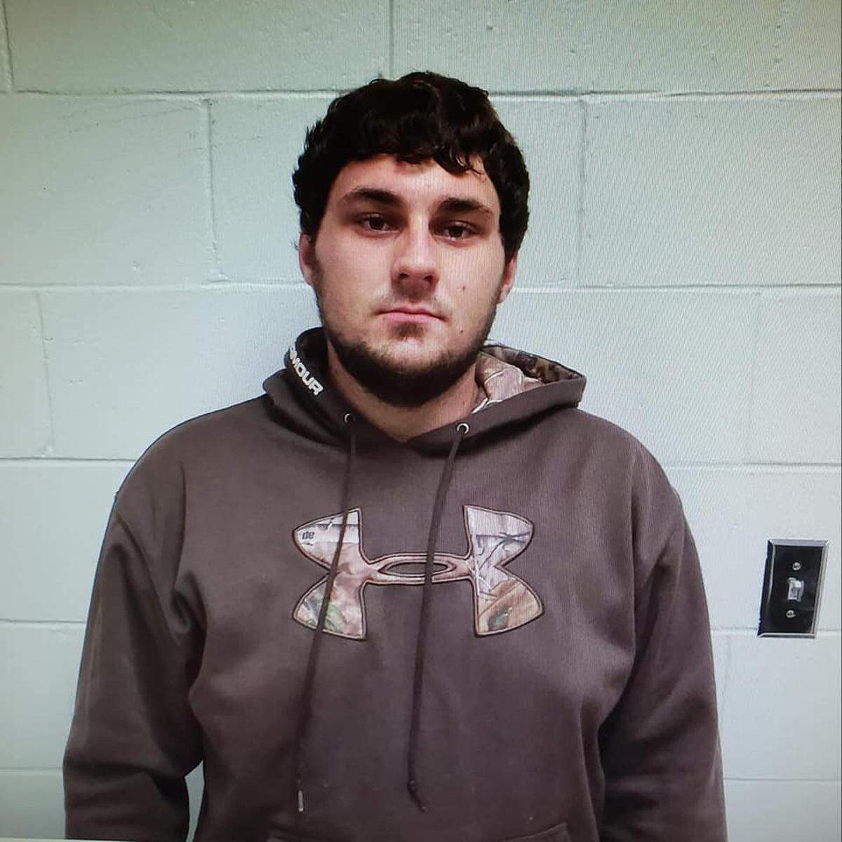Kody B. Wilson, 21, faces corpse abandonment charges after officials in Dallas County, Missouri say he and another man visited the dead bodies of a husband and wife murdered on Sept. 30 and did not alert authorities.