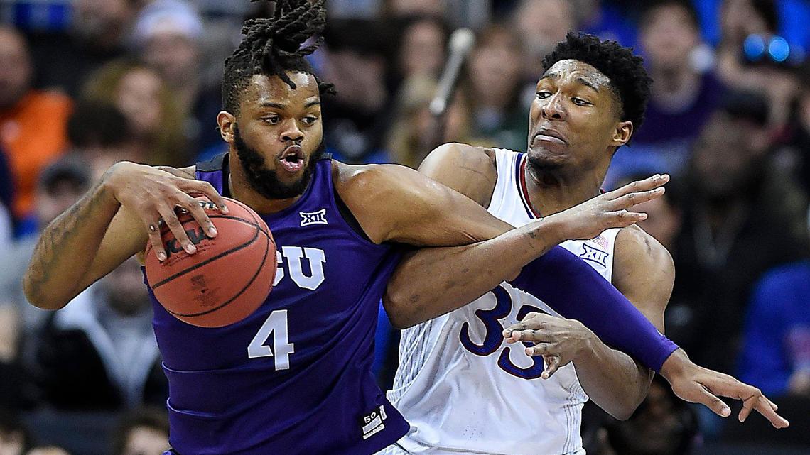 TCU’s Eddie Lampkin (left) battled with KU’s David McCormack during the first half of Friday’s semifinal game at the Big 12 Conference Tournament in Kansas City (March 11, 2022).