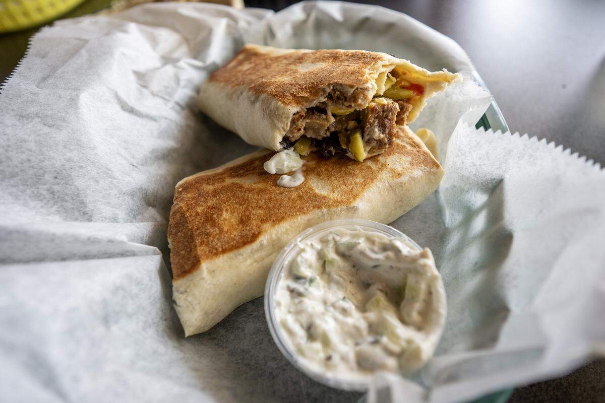 Gyro hero, paired with a house-made sauce is served at Hummus and Pita on Tuesday, Sept. 2, 2025, in Overland Park.