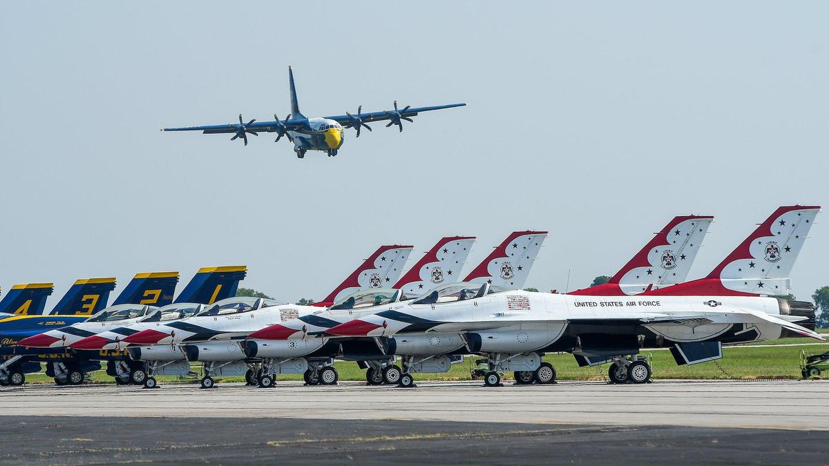 After the Navy parachute team Leap Frogs performed, “Fat Albert,” the C-130 plane that carried them, flew over Blue Angels and Thunderbirds as it prepared to land on the second and final day of the 2021 Kansas City Airshow at the New Century AirCenter in New Century, Kansas, July 4, 2021.