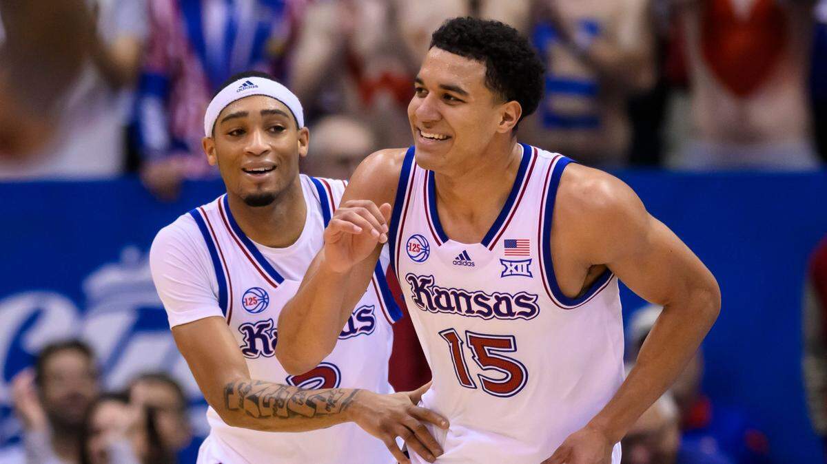 Kansas guard Kevin McCullar Jr. (15) celebrates a basket against Indiana with teammate Dajuan Harris Jr. (3) during the second half in Lawrence, Kan., Saturday, Dec. 17, 2022.