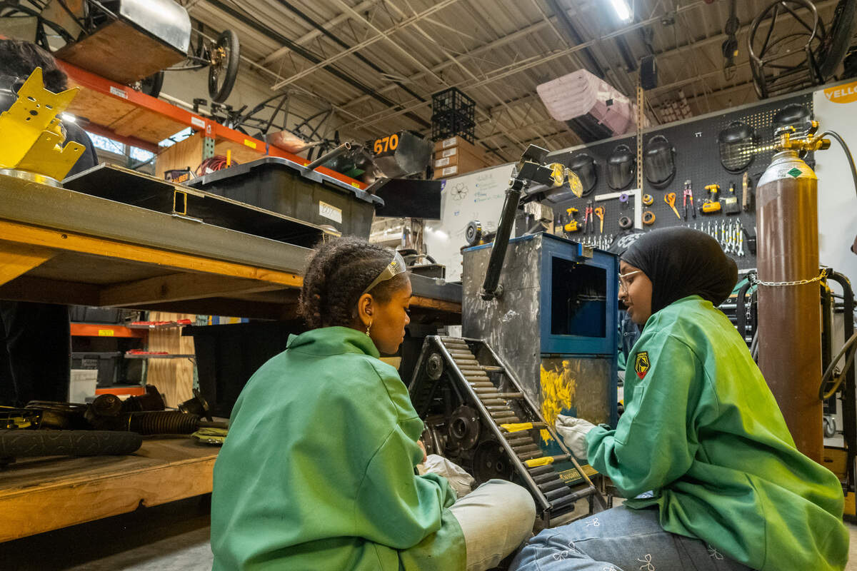 Students create a life-size Wall-E out of an old Kansas City Star newspaper dispenser.