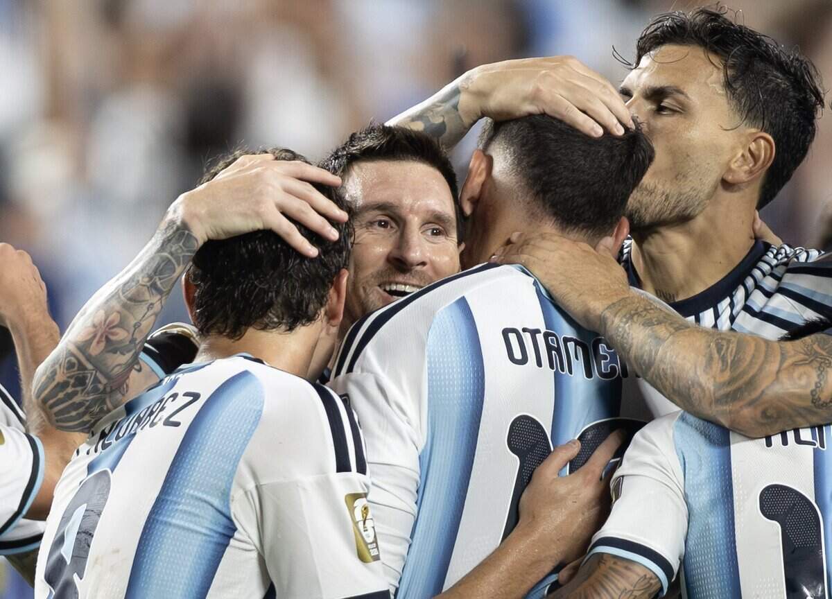 Argentina forward Lionel Messi (10) celebrates with teammates after they defeated Switzerland after the FIFA World Cup quarterfinal match at Kansas City (Arrowhead) Stadium in Kansas City on Saturday, July 11, 2026.