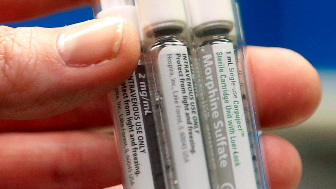 File photo of morphine sulfate. Authorities say a Minnesota pharmacist replaced morphine with water after taking some of the drug from a stock bottle.