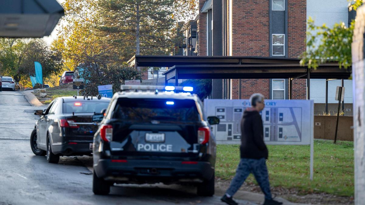 Police cars line East Larkspur Lane during an officer-involved shooting at the Oval Spring Apartments on Thursday, Nov. 7, 2024, in Independence.