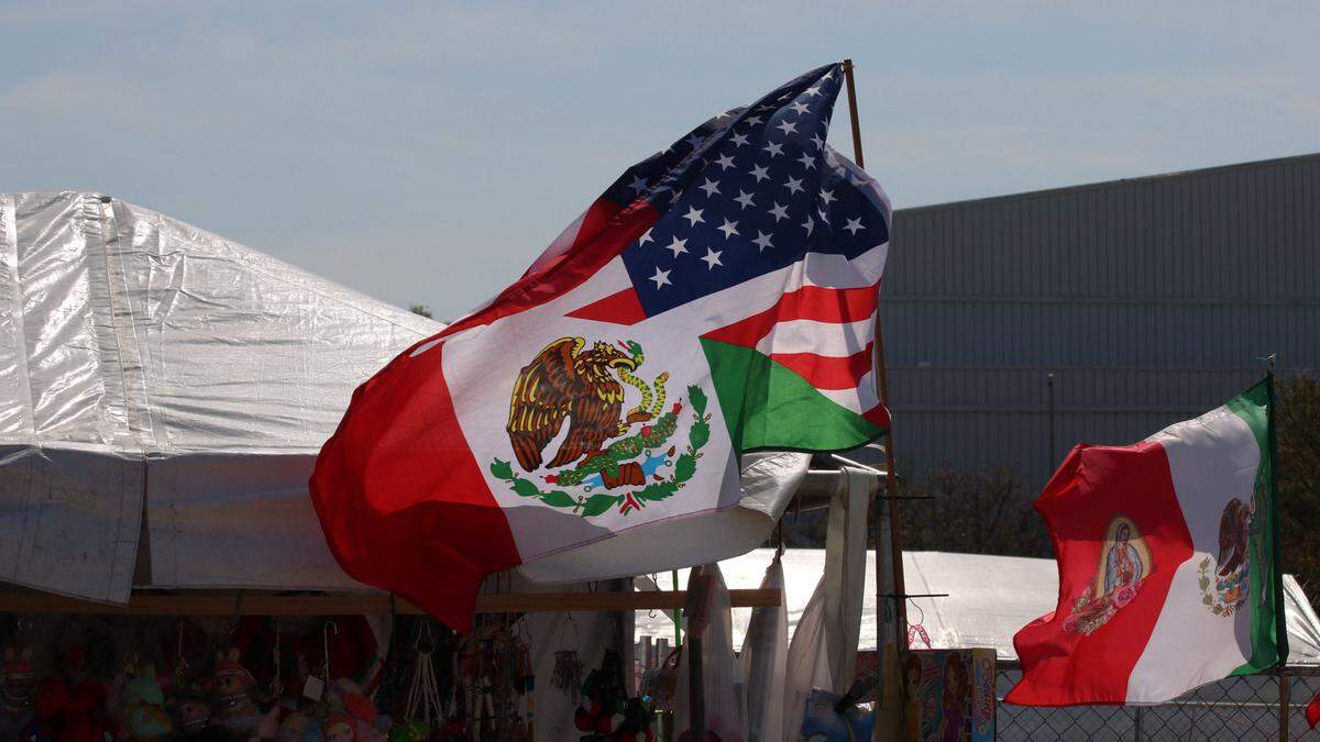 A half-Mexican, half-American flag is seen flying at a vendor booth on Saturday, Sept. 13 at Fiesta Hispana in Kansas City.