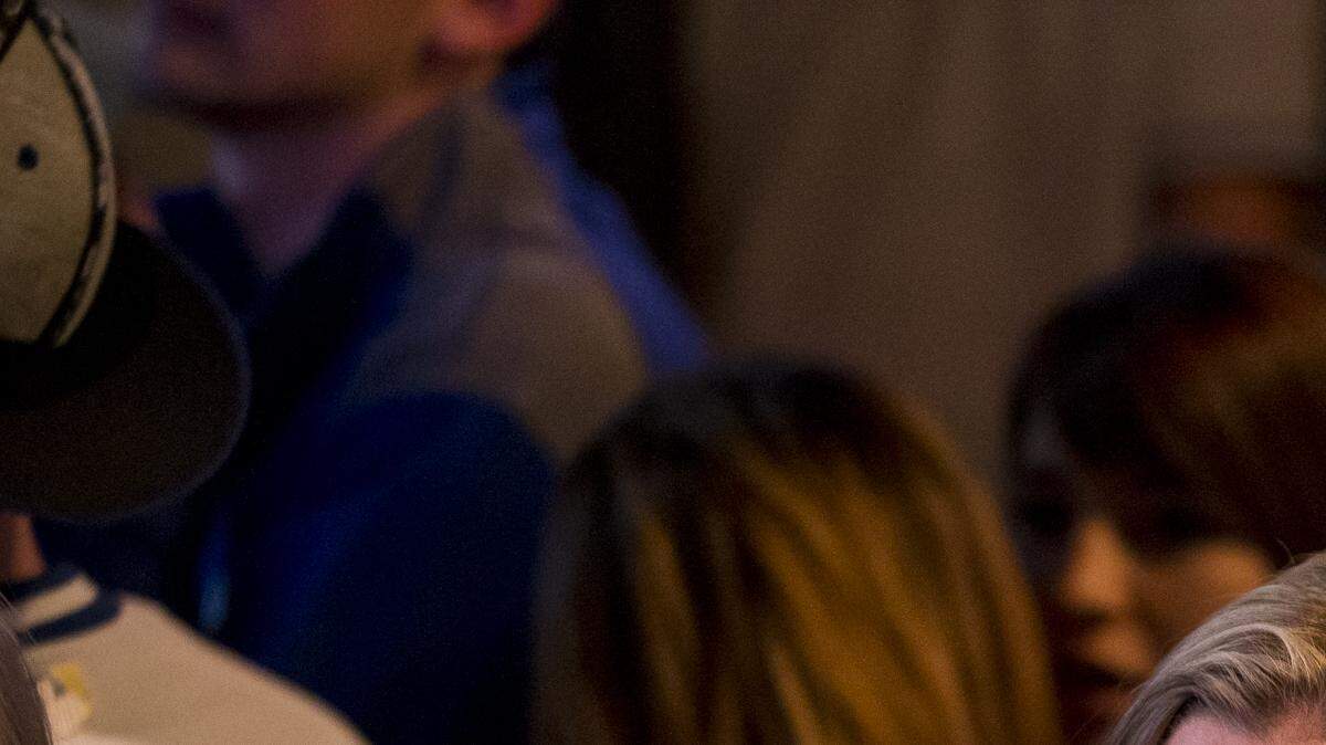 AJ Jamison and Danielle Svendsen both of St. Joseph, Missouri watch the final innings of Game 7 of the 2014 World Series during a watch party at Duke's on Grand on October 29, 2014.