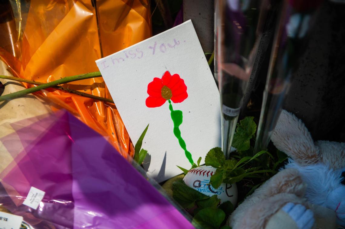 A makeshift memorial was set up by family and friends in front of the house at 7212 N Avalon St in northwest Kansas City, where a fire took the lives of three boys, 10-year-old Chace Freeman, 4-year-old Achilles Hardy and 2-year-old Maxwell Hardy on Wednesday, July 14, 2021.