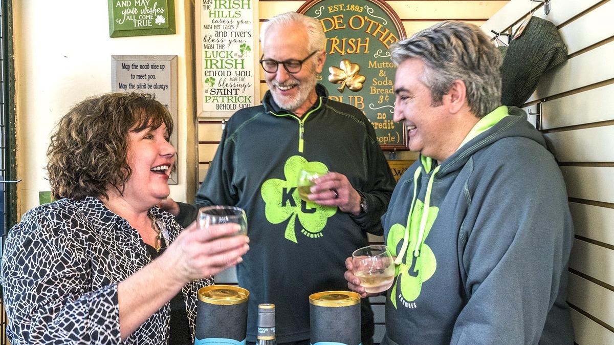 Kerry Browne, her husband and business partner John McClain (center), and George Vial taste-test some single-barrel Irish whiskey at  Browne's Irish Market.