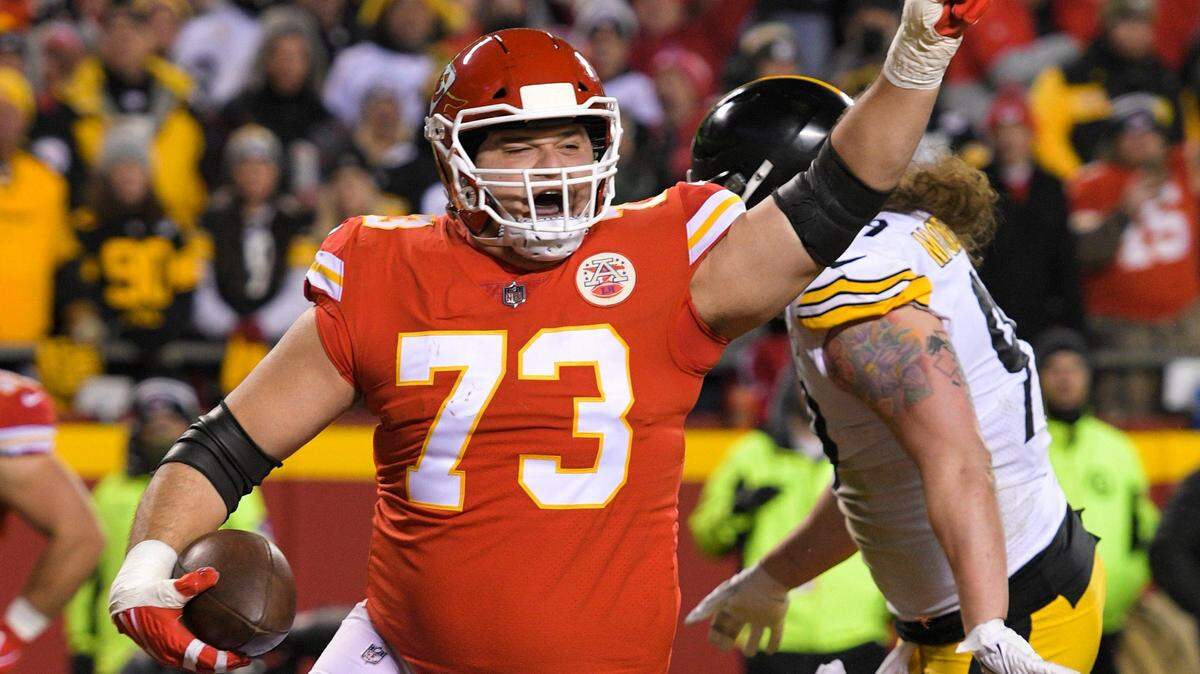 Chiefs guard Nick Allegretti celebrated after scoring a touchdown against the Pittsburgh Steelers during the second half of an NFL wild-card playoff football game, Sunday, Jan. 16, 2022 in Kansas City.