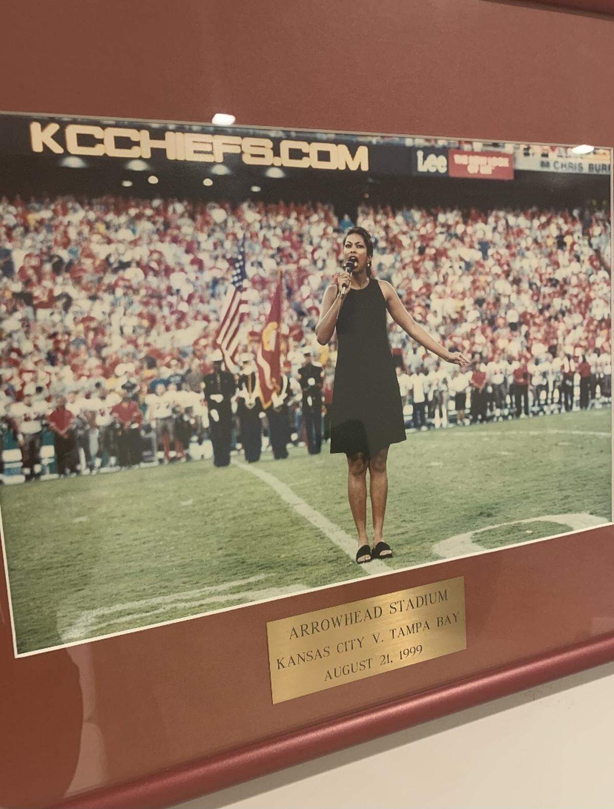 In her home office, Harris Faulkner keeps a framed photograph of the time she sang the national anthem before a 1999 Chiefs game against the Tampa Bay Buccaneers.