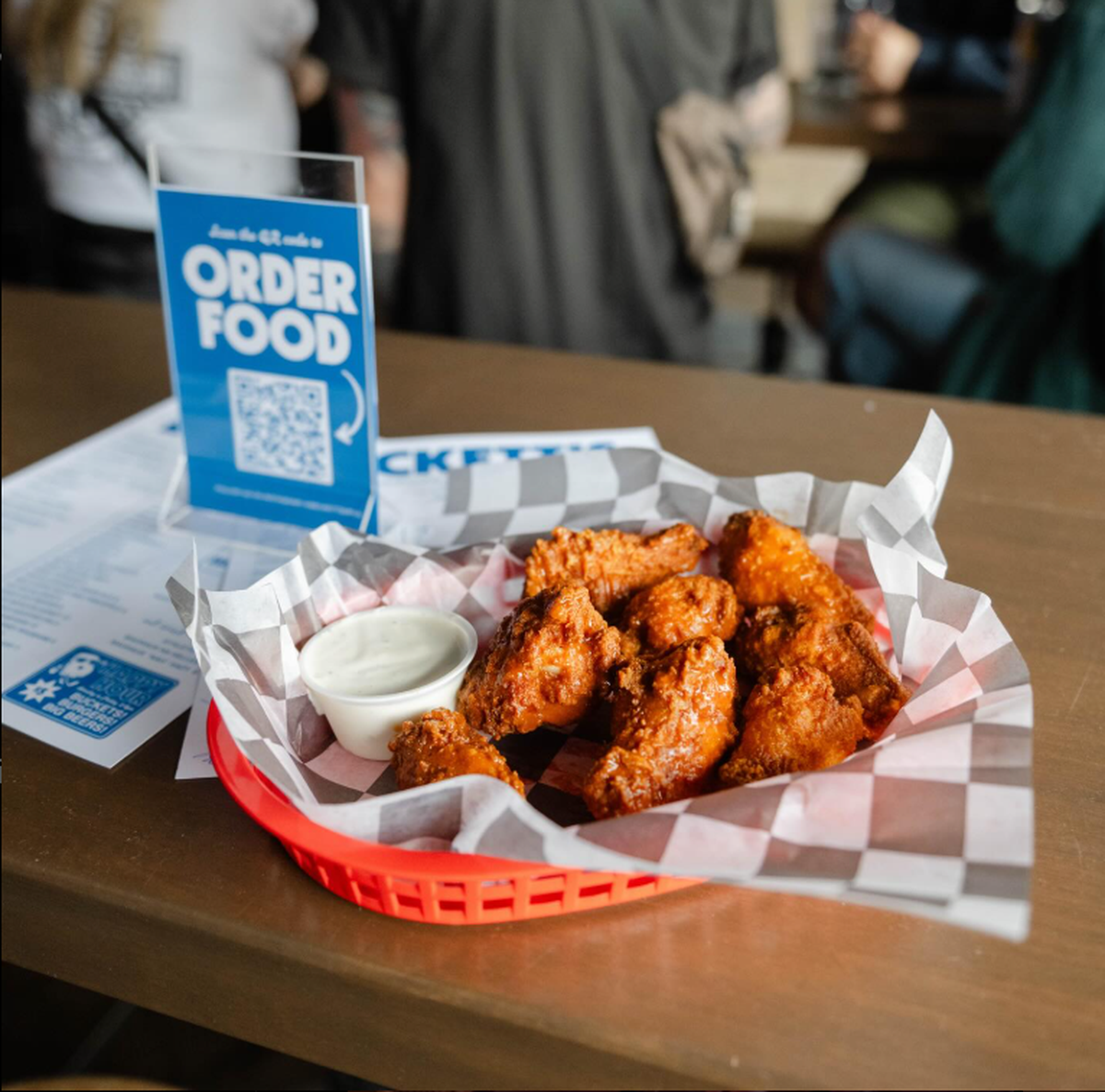 Becketts is a sports bar that primarily serves drinks but also serves food.
