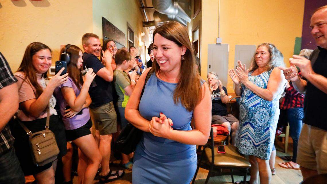 Mo. gubernatorial candidate Crystal Quade is greeted by supporters as she make her way into her watch part at Big Momma’s Coffee and Espresso Bar on Tuesday, Aug. 6, 2024.