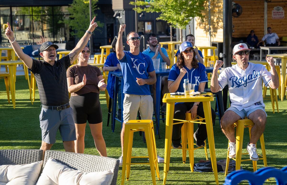 Royals fans Eric Klinger, Valerie Klinger, Matt Klinger, Lindsay Underwood, and Todd Klinger celebrated as the Kansas City Royals defeated the Baltimore Orioles 1-0 to win the AL Wild Card game on Tuesday, Oct. 1, 2024. The group gathered at SERV in Overland Park to watch the game, which was played in Baltimore. The Klingers are from Overland Park and Underwood is from Olathe.