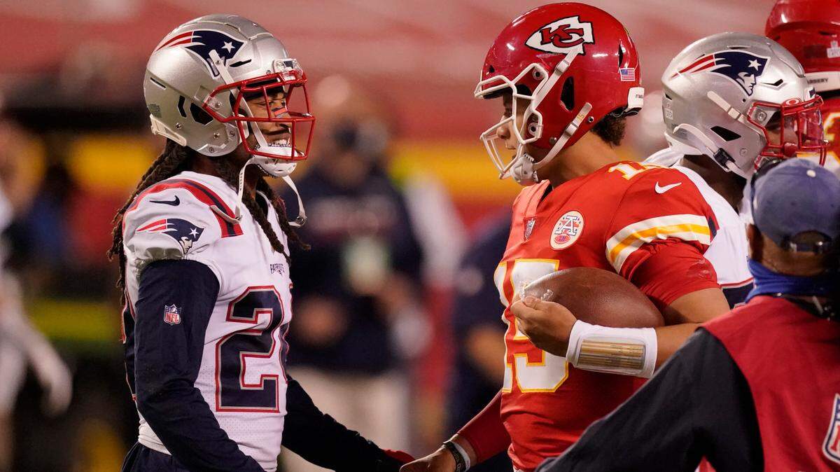 New England Patriots cornerback Stephon Gilmore, left, talks with Kansas City Chiefs quarterback Patrick Mahomes after an NFL football game, Monday, Oct. 5, 2020, in Kansas City. The Chiefs won 26-10. (AP Photo/Charlie Riedel)