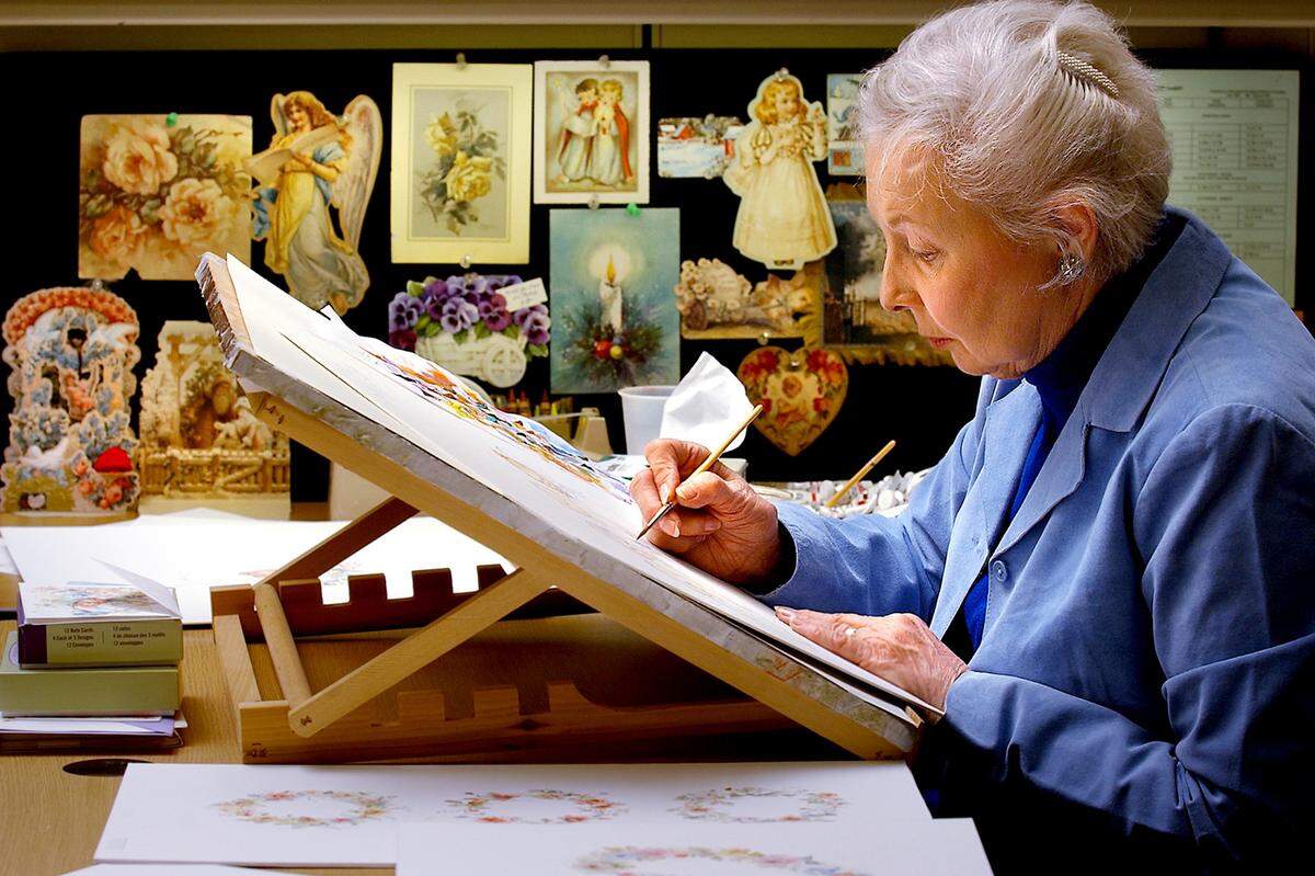 Artist Mary Hamilton paints a bear at her Hallmark easel. Hamiltion’s Hallmark card lines included “Mary’s Bears” and “Mary’s Sprites.” Hamilton used cards people sent her (seen in the background) as inspiration for her artwork.