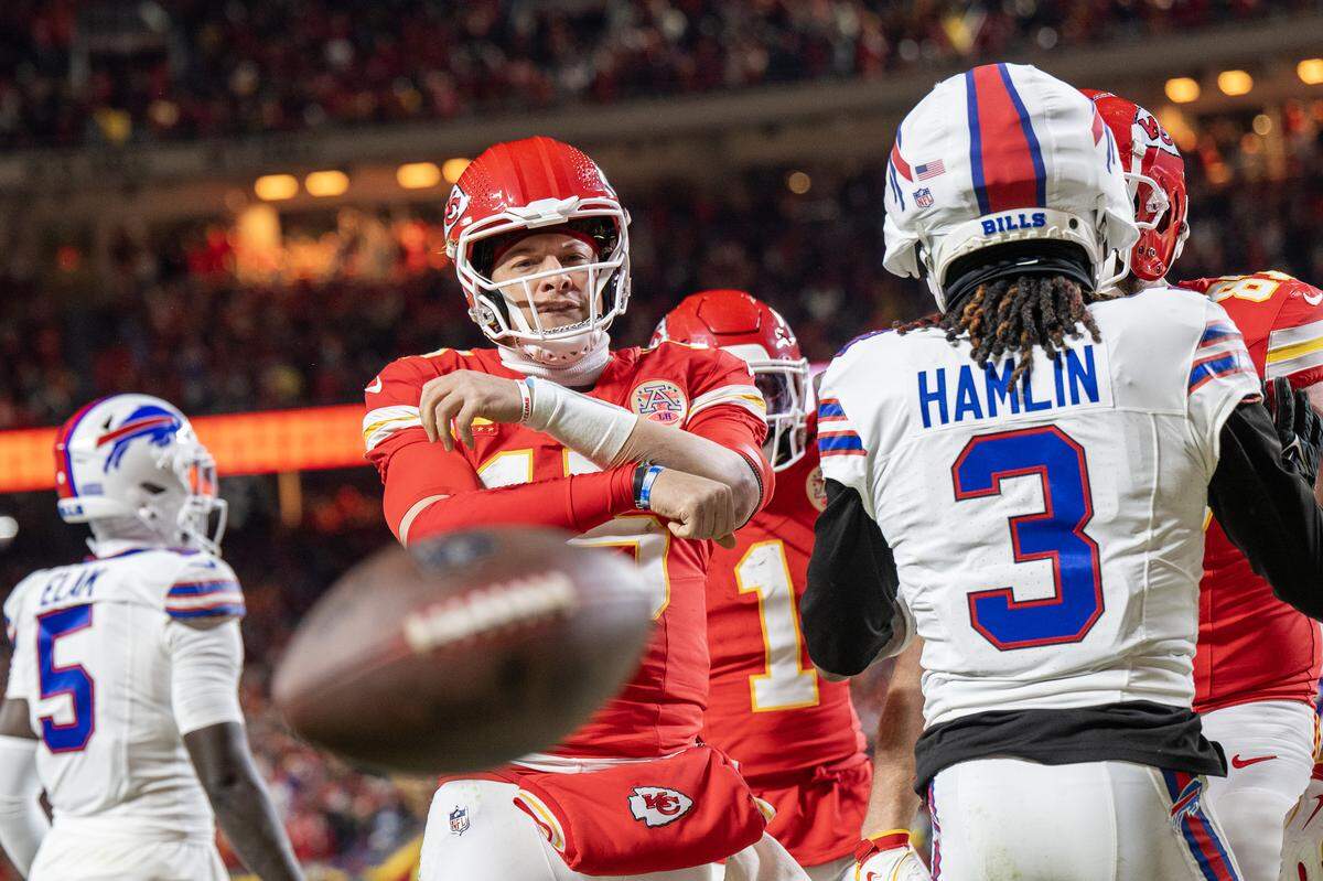 Kansas City Chiefs quarterback Patrick Mahomes (15) throws the ball after making a touchdown in the second quarter against the Buffalo Bills during the AFC Championship Game on Sunday, Jan. 26, 2025, at GEHA Field at Arrowhead Stadium. 