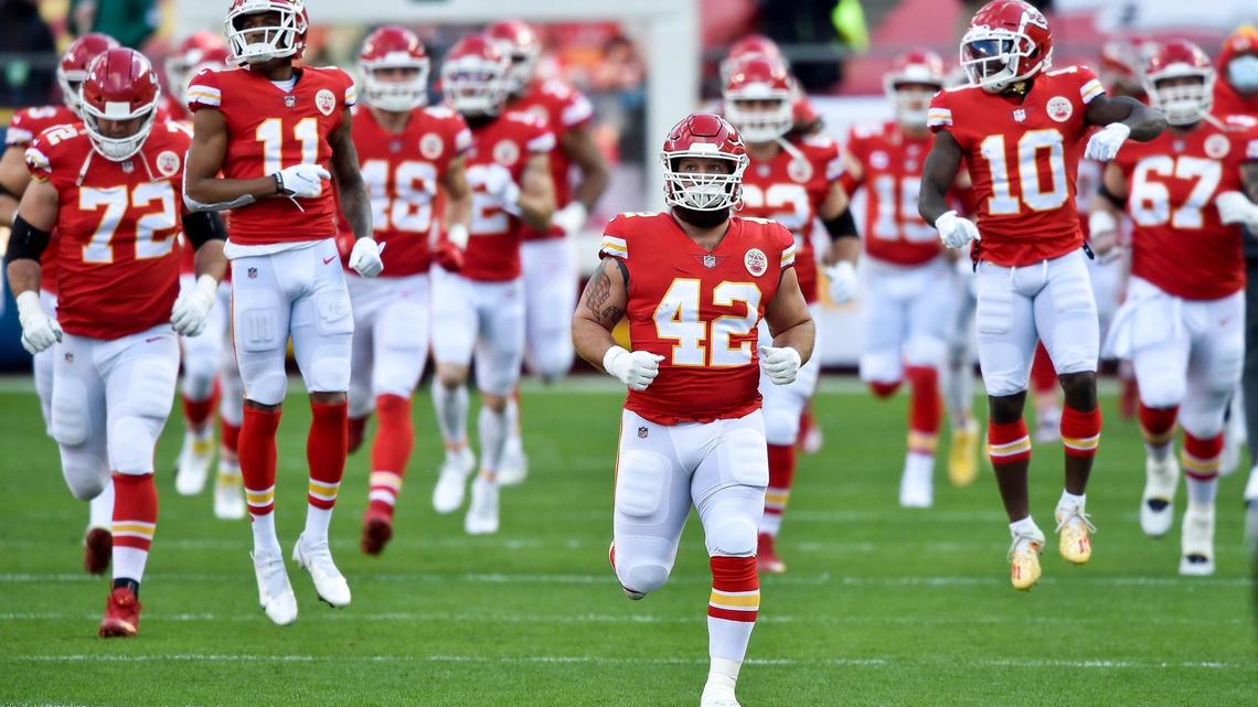 Kansas City Chiefs fullback Anthony Sherman (42) and teammates including leaping wide receivers Demarcus Robinson (11) Tyreek Hill (10) enter the field before the start of the AFC Divisional Playoff game between the Chiefs and the Cleveland Browns at Arrowhead Stadium Sunday, Jan. 17, 2021. The Chiefs defeated the Browns 22-17.