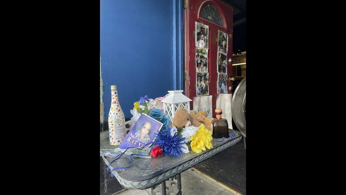 A memorial for Antoinette “Libby” Brenson was set up inside the Klymax Lounge following the May shooting. Another member of Brenson’s family passed away shortly after. Their flowers and funeral mementos have been combined ahead of the August event scheduled to commemorate Brenson’s life.