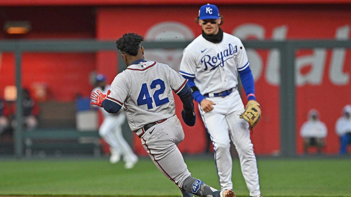Atlanta Braves second baseman Ozzie Albies (1) rounds second past Kansas City Royals shortstop Bobby Witt Jr. (7) during the fifth inning at Kauffman Stadium on April 15, 2023.