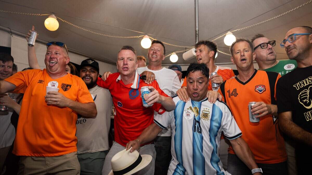 Family and friends of The Pig Lebowski team, along with Dutch visitors dance to "Links Rechts" at The Great Lenexa BBQ Battle on Friday, June 26, 2026.
