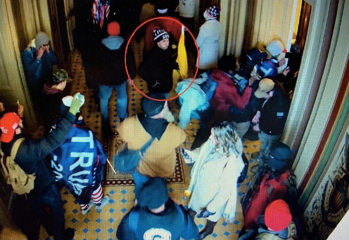 A man the FBI says is Mark Roger Rebegila of St. Marys, Kansas, is shown (inside the red circle) on U.S. Capitol closed-circuit television roaming through the building on Jan. 6.