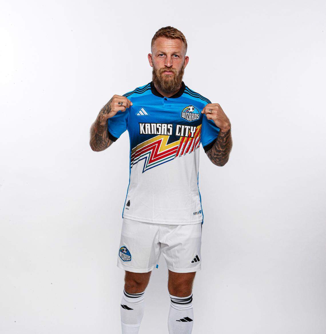 Sporting KC captain Johnny Russell sports the club’s throwback kit with references to the Kansas City Wizards.