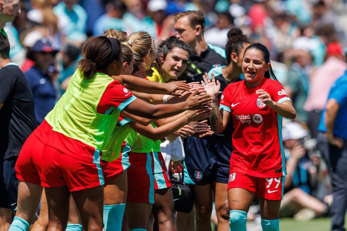 KC Current teammates congratulate midfielder Debinha, right, after one of her two first-half goals against Bay FC during a National Women’s Soccer League match at CPKC Stadium in Kansas City on Sunday, May 11, 2025.