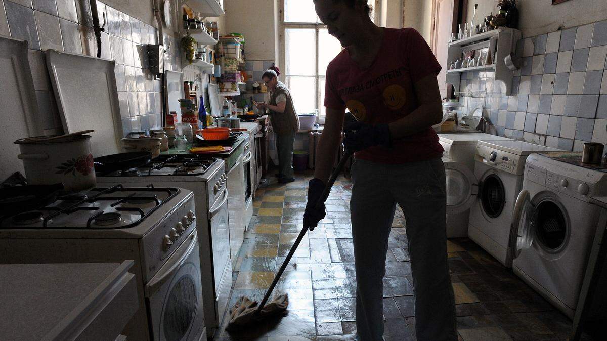 a woman cleaning her home.