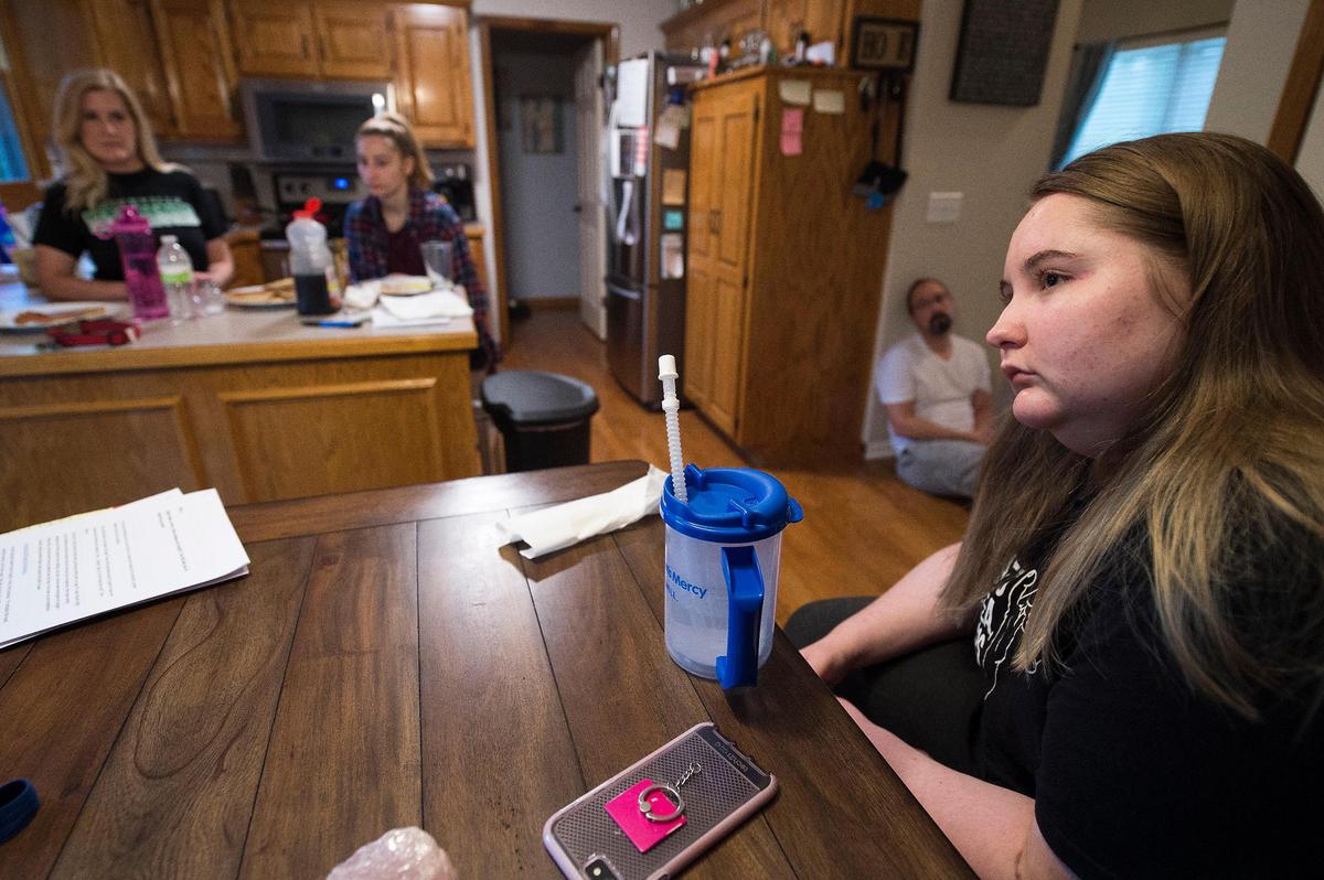 Jordyn Walker is in a contemplative mood over breakfast in her Smithville home with family, from left, mom Kendyll Walker, sister Samantha Walker and her mom’s fiance, Shannon Loerzel.