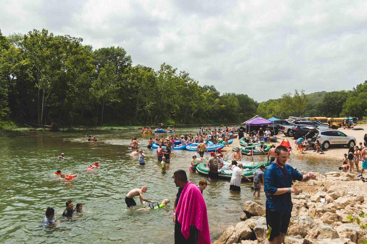 Several tourist stop and jump off of Low Water Bridge June 26 on the Elk River while on a float trip. The river is located in McDonald County which has seen a recent surge in COVID-19 cases.