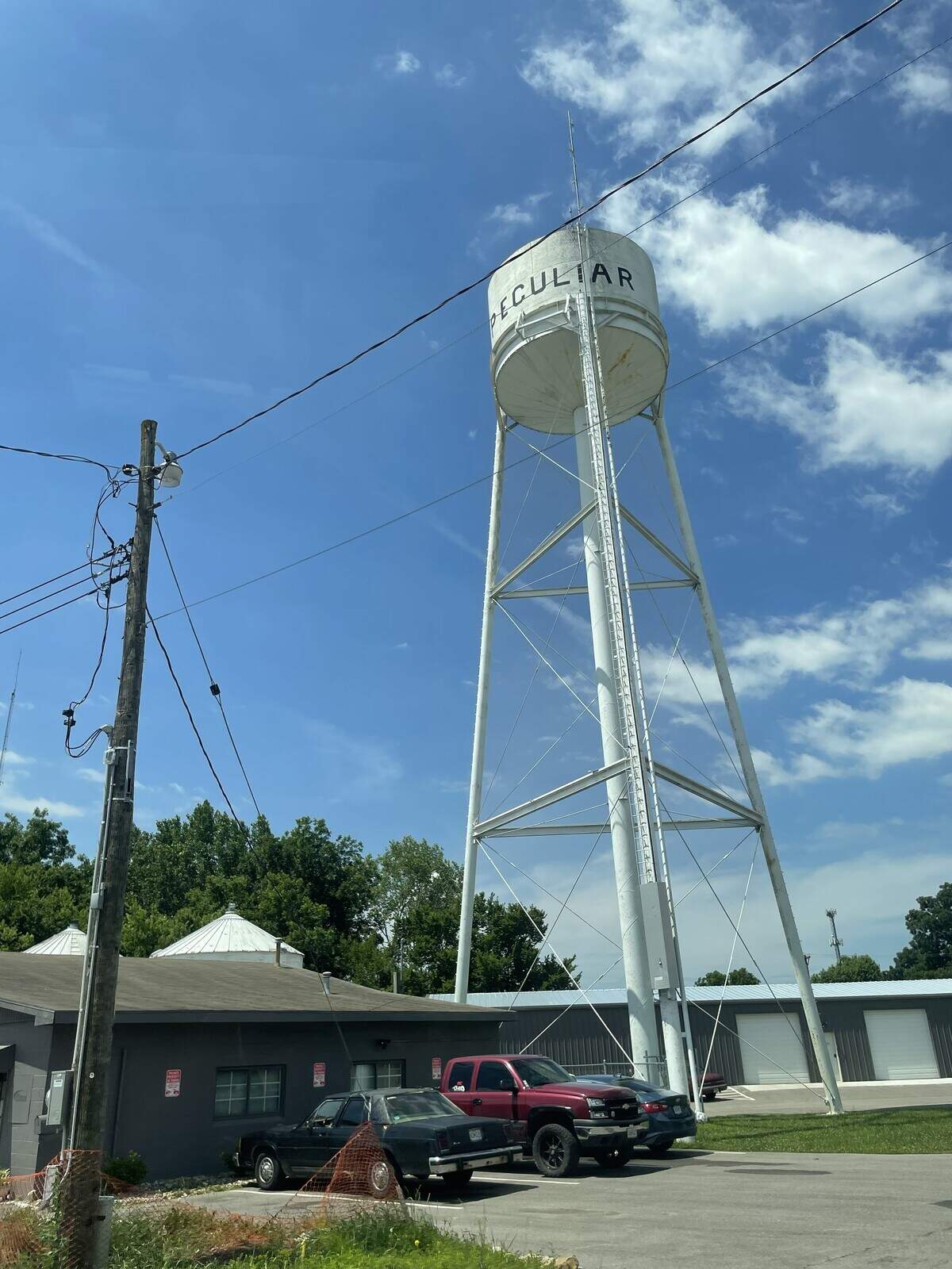 A three-legged water town stands over downtown Peculiar, Missouri, on the morning of June 16, 2026.