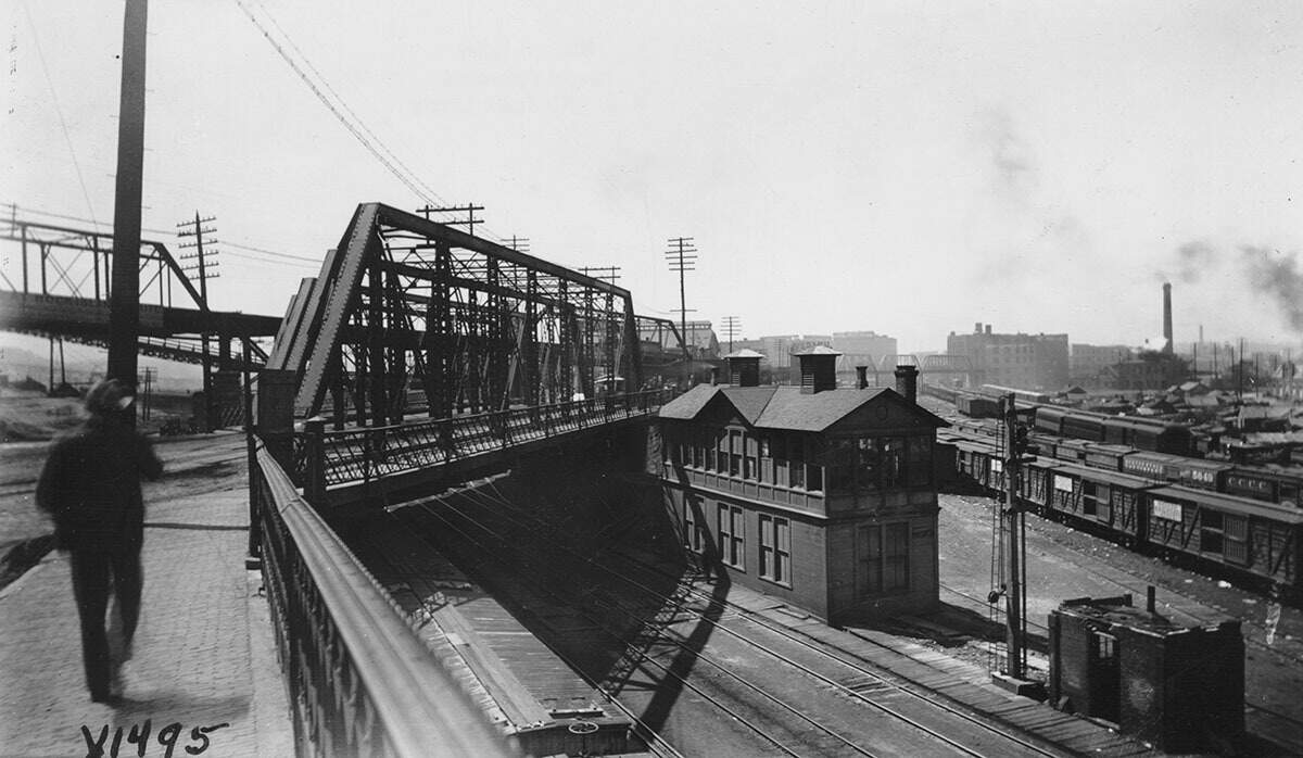 A pedestrian preparing to cross the Bluff Street Bridge into the West Bottoms, 1894.
