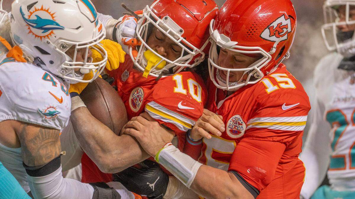 Kansas City Chiefs running back Isiah Pacheco (10) gets a push from quarterback Patrick Mahomes (15) into the end zone for a touchdown in the fourth quarter during an AFC Wild Card game against the Miami Dolphins at GEHA Field at Arrowhead Stadium on Saturday, Jan. 13, 2024, in Kansas City.